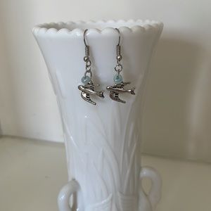 Handmade, bird earrings with light blue beads and silver accents.